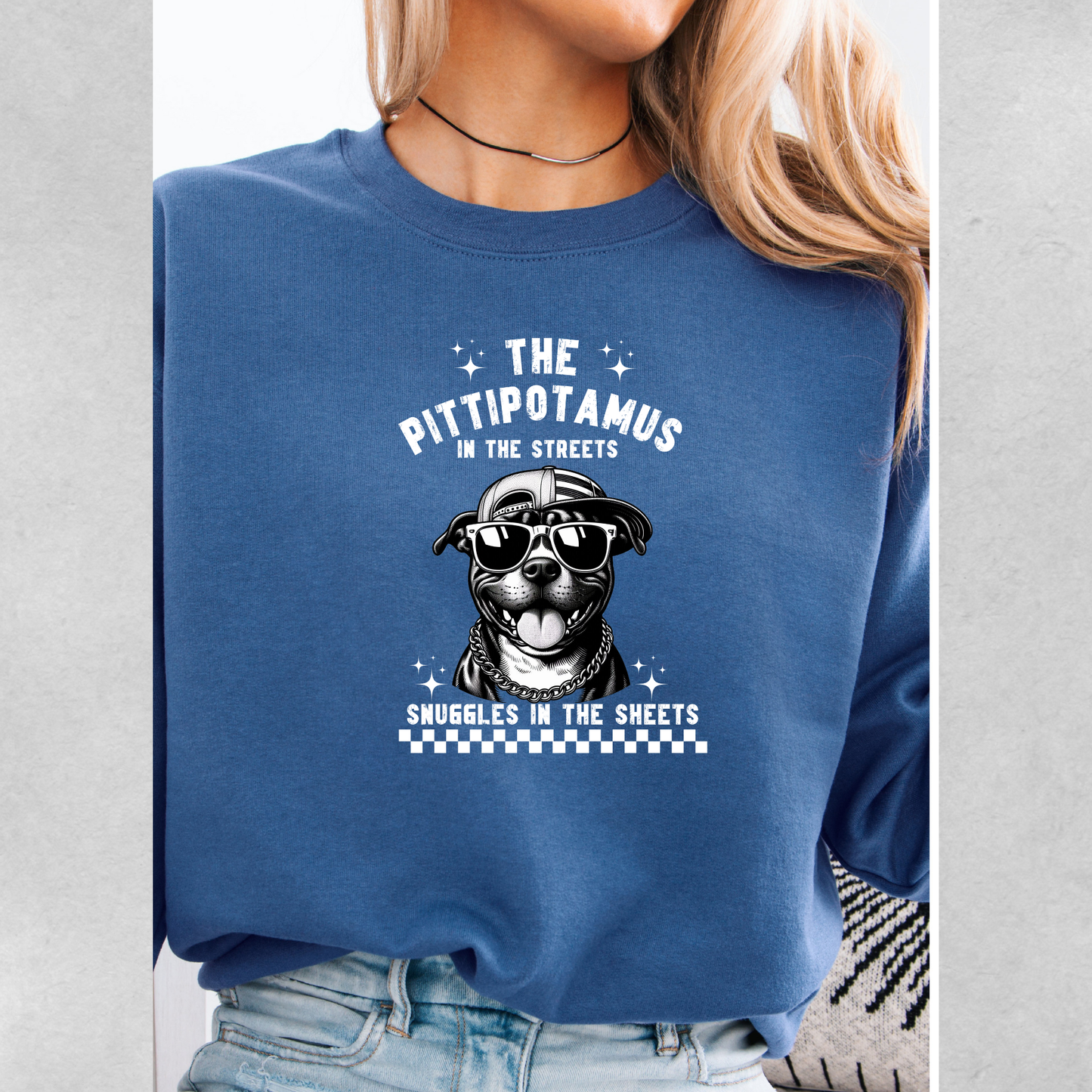 The pittipotamus snuggles in the sheets crewneck