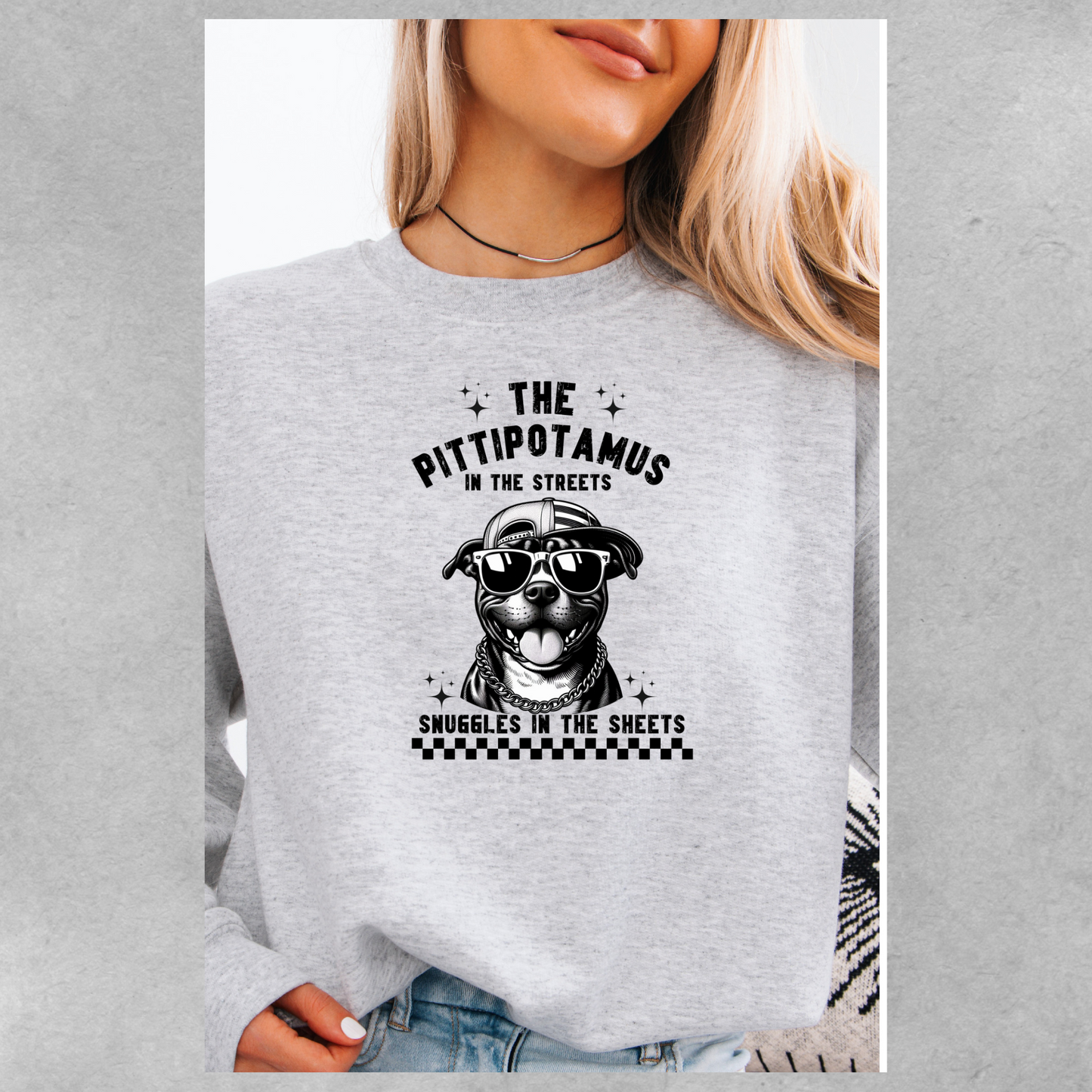 The pittipotamus snuggles in the sheets crewneck
