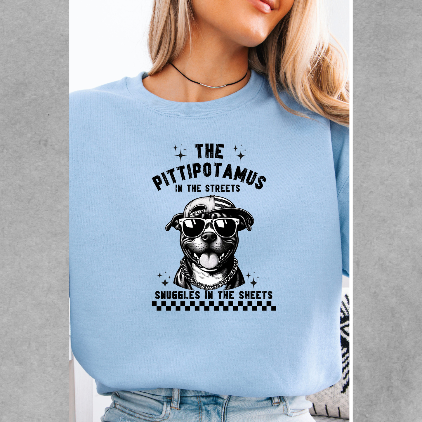 The pittipotamus snuggles in the sheets crewneck