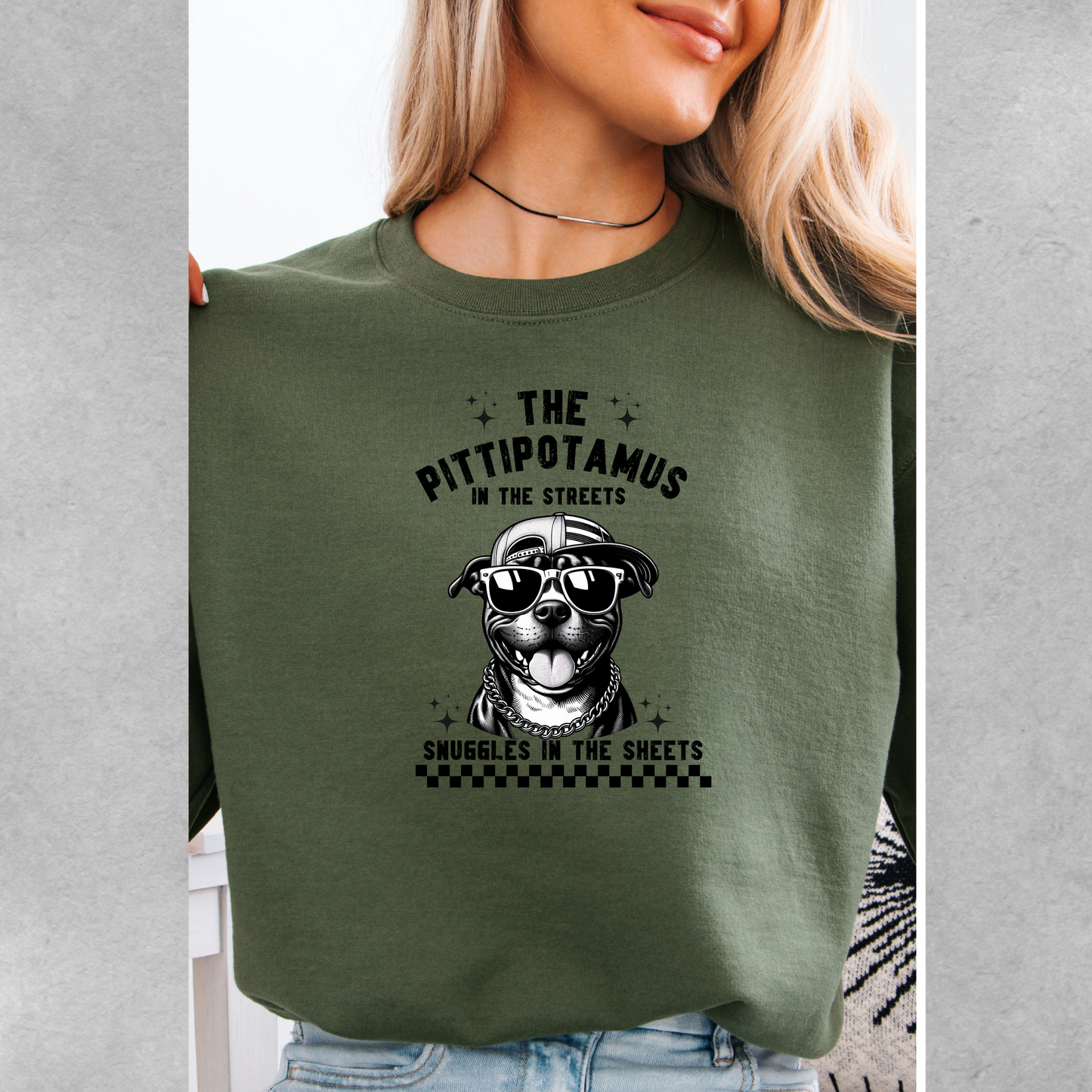 The pittipotamus snuggles in the sheets crewneck